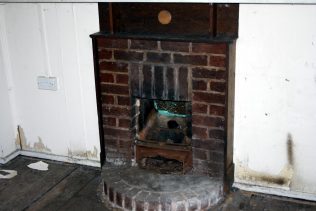 Fireplace in one of the empty prefabs, Wake Green Road, Moseley, Birmingham. June 2016 | Prefab Museum