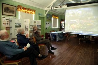 Visitors at the Rural Life Centre, July 2016, viewing a film about prefabs | Prefab Museum