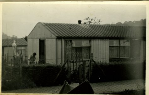 An Arcon Mk V with man in garden on the Bishpool Estate, Newport, Wales, 50s