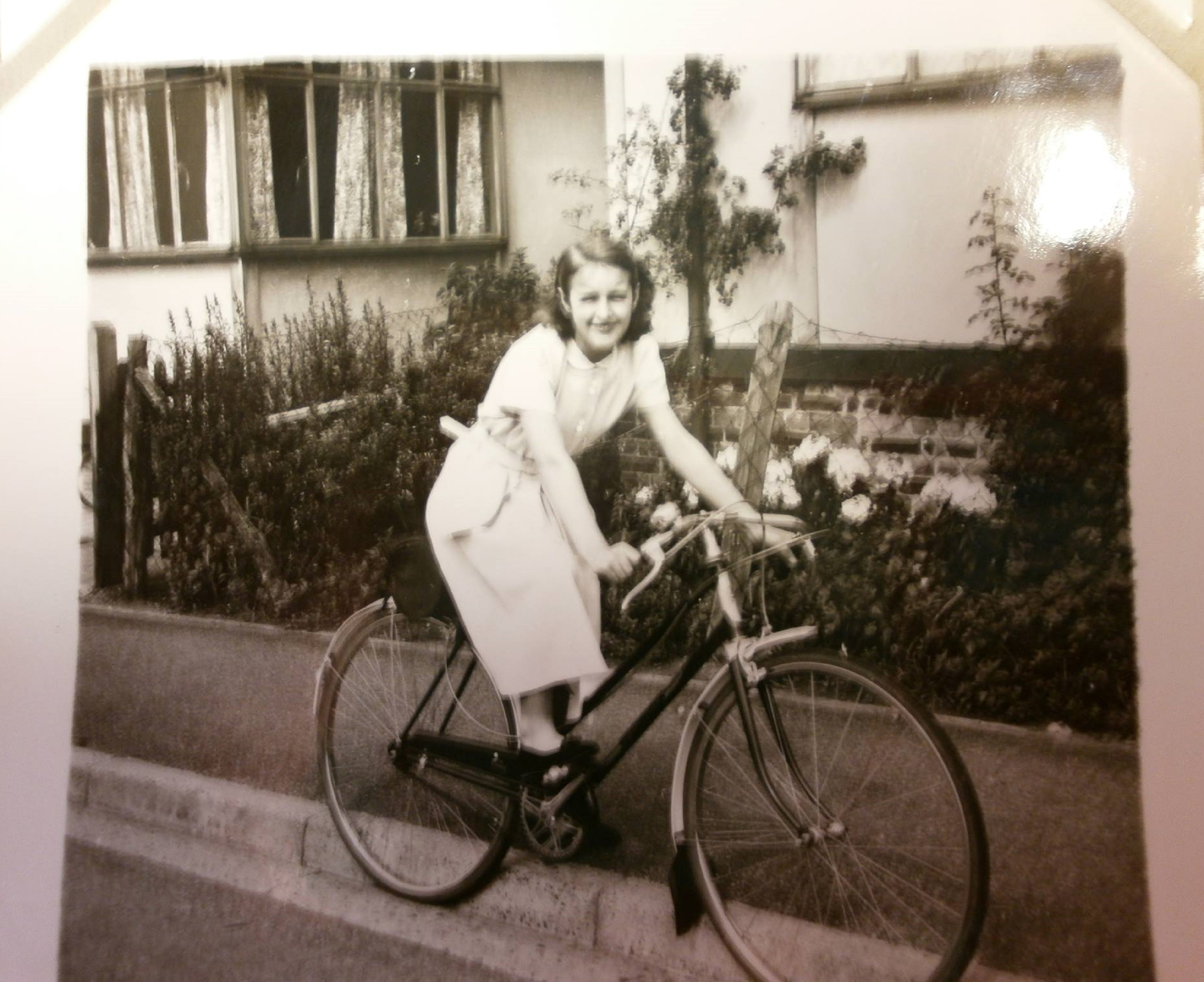 Eileen's sister Pat on her new bike in front of the prefab, Lower Jackwood Close, Eltham