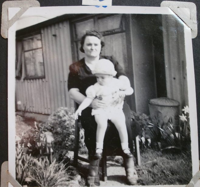 Woman with baby in front of Arcon prefab | Hearn,Jane