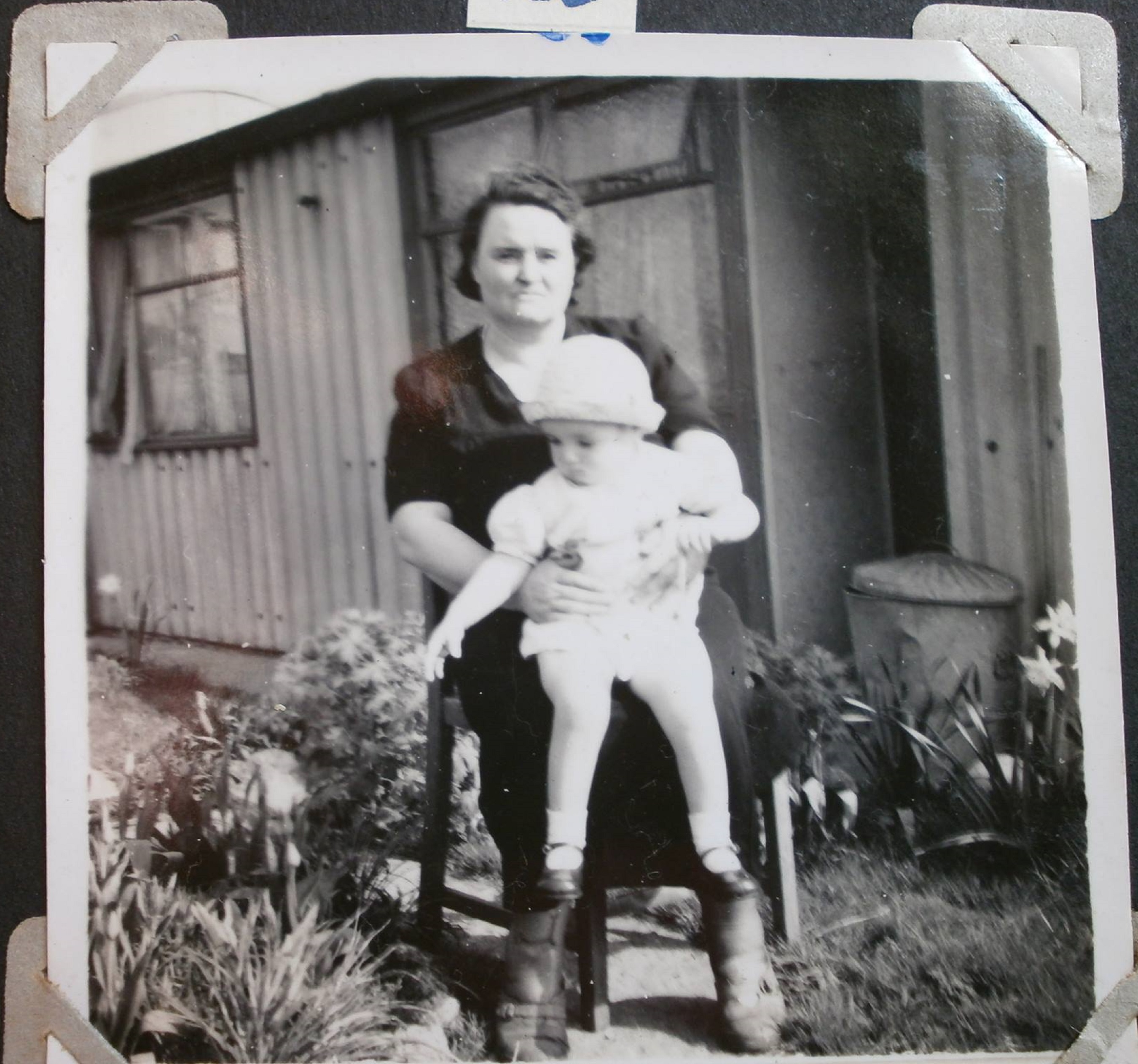 Woman with baby in front of Arcon prefab