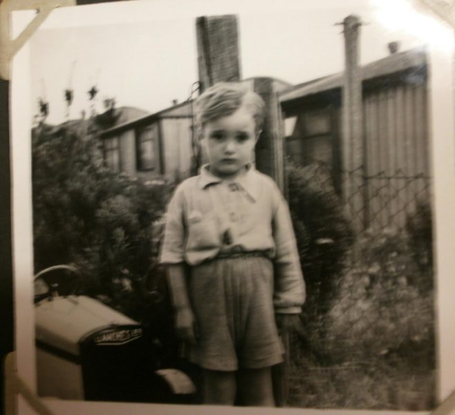 Small boy with toy car in front of Arcon prefab | Hearn,Jane