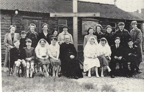 The Brine family outside St Mark's Church, before it was rebuilt as the "Prefab Church"