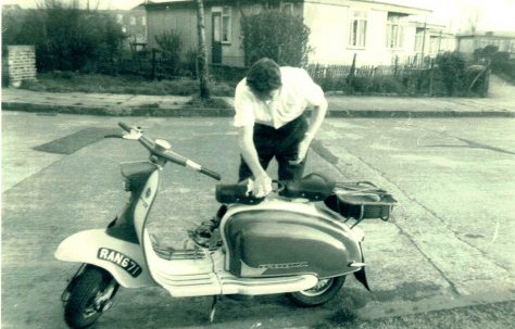 Bob Strudwick working on his scooter, taken from Mr and Mrs Marshalls prefab at No 6, Strattondale Street, Isle of Dogs, London 50s or 60s