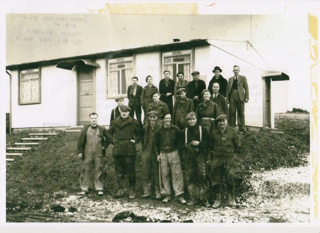 John Mason with other men in front of an AIROH Prefab  on the Wilson Avenue site, Whitehawk, Brighton in 1946. | Blanchet,Elisabeth