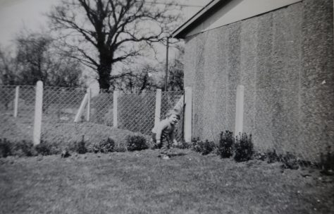 One of the Kapitan children playing in the prefab garden