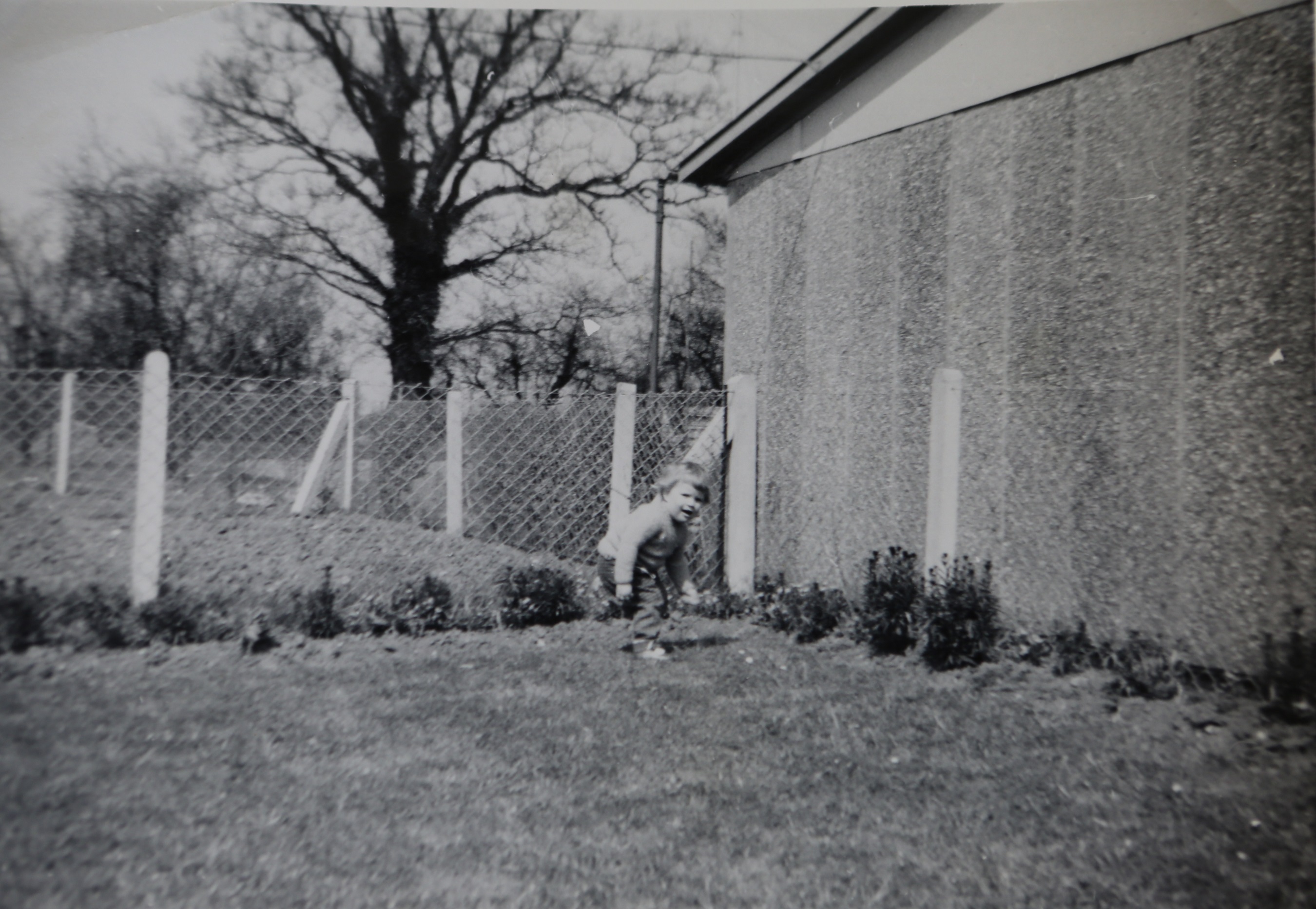 One of the Kapitan children playing in the prefab garden