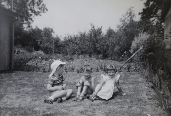 Three small children in the Kapitan prefab garden in Ipswich | Hearn,Jane