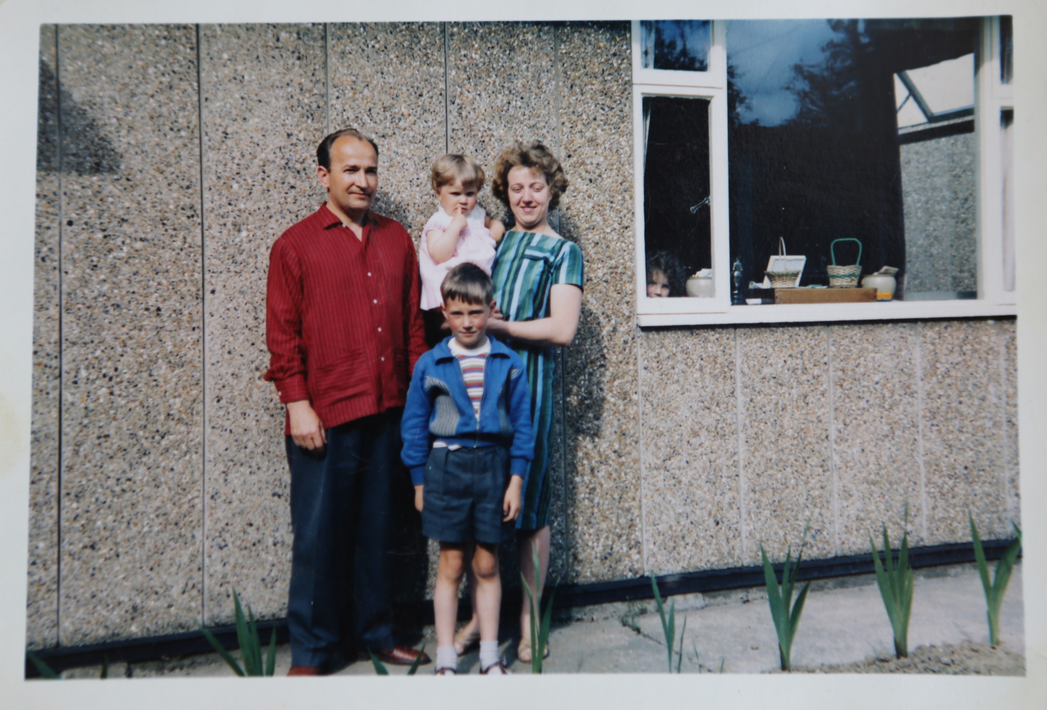 Mrs and Mrs Kapitan with their two children in front of their Ipswich prefab