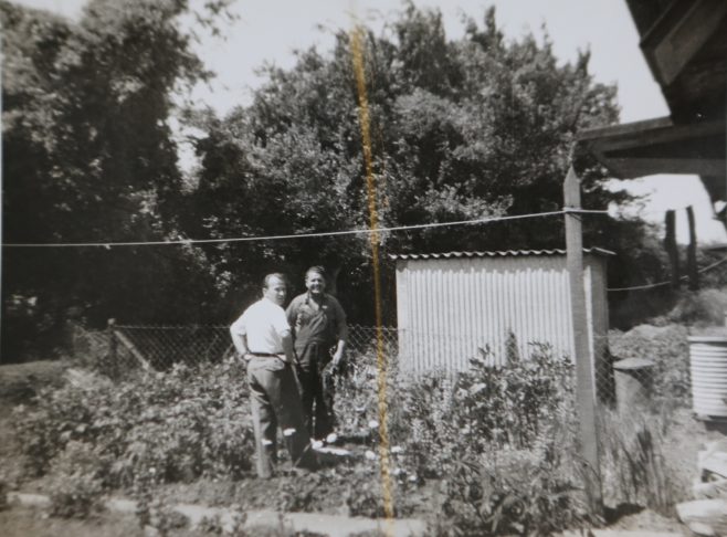 Mr Kapitan and friend in his prefab garden | Hearn,Jane