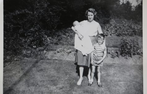 June Kapitan and her two children outside their prefab in Ipswich