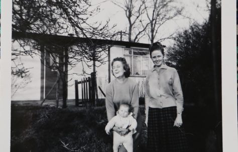 Penny Bishop and family outside their prefab in Willesden