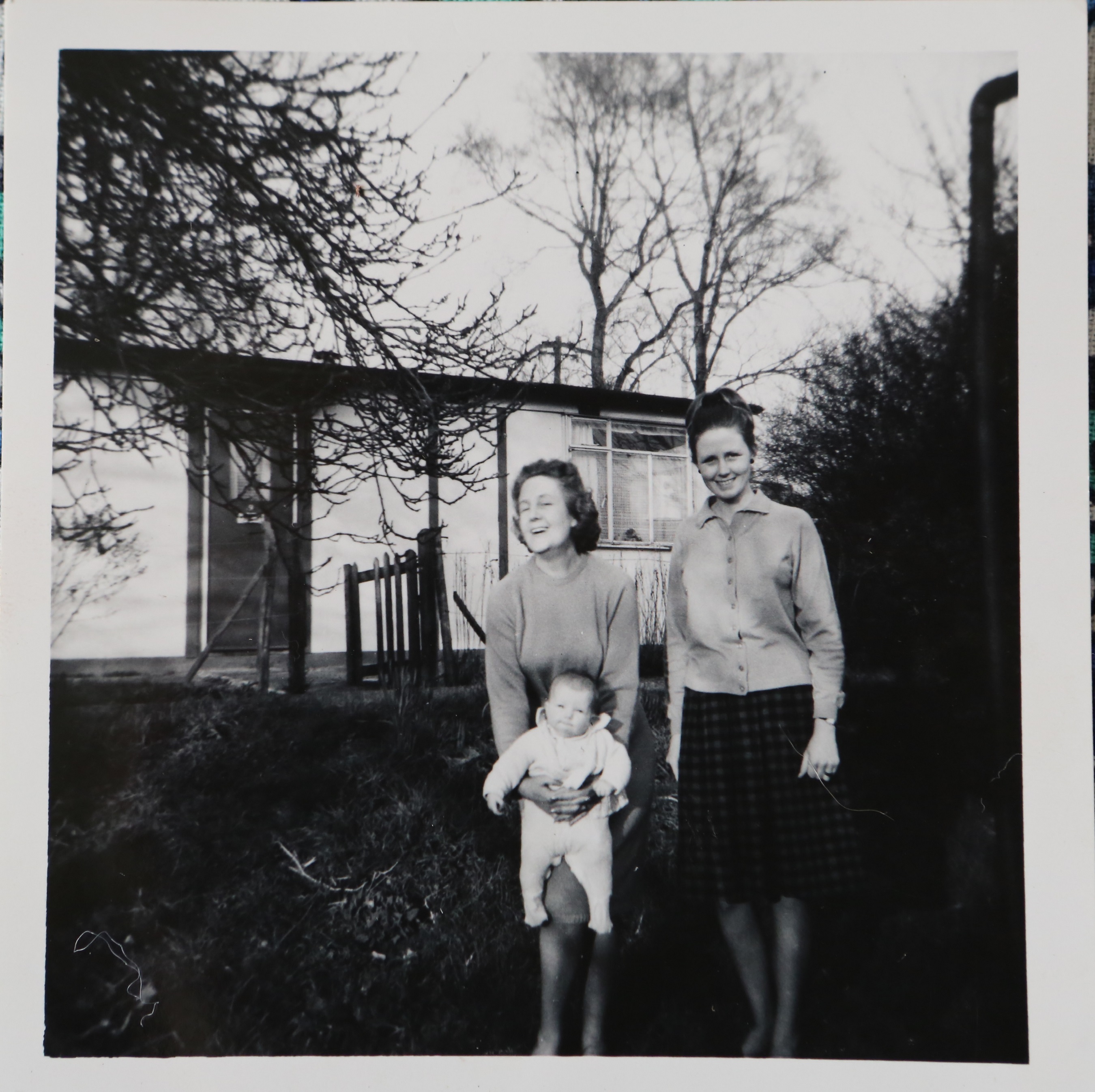 Penny Bishop and family outside their prefab in Willesden