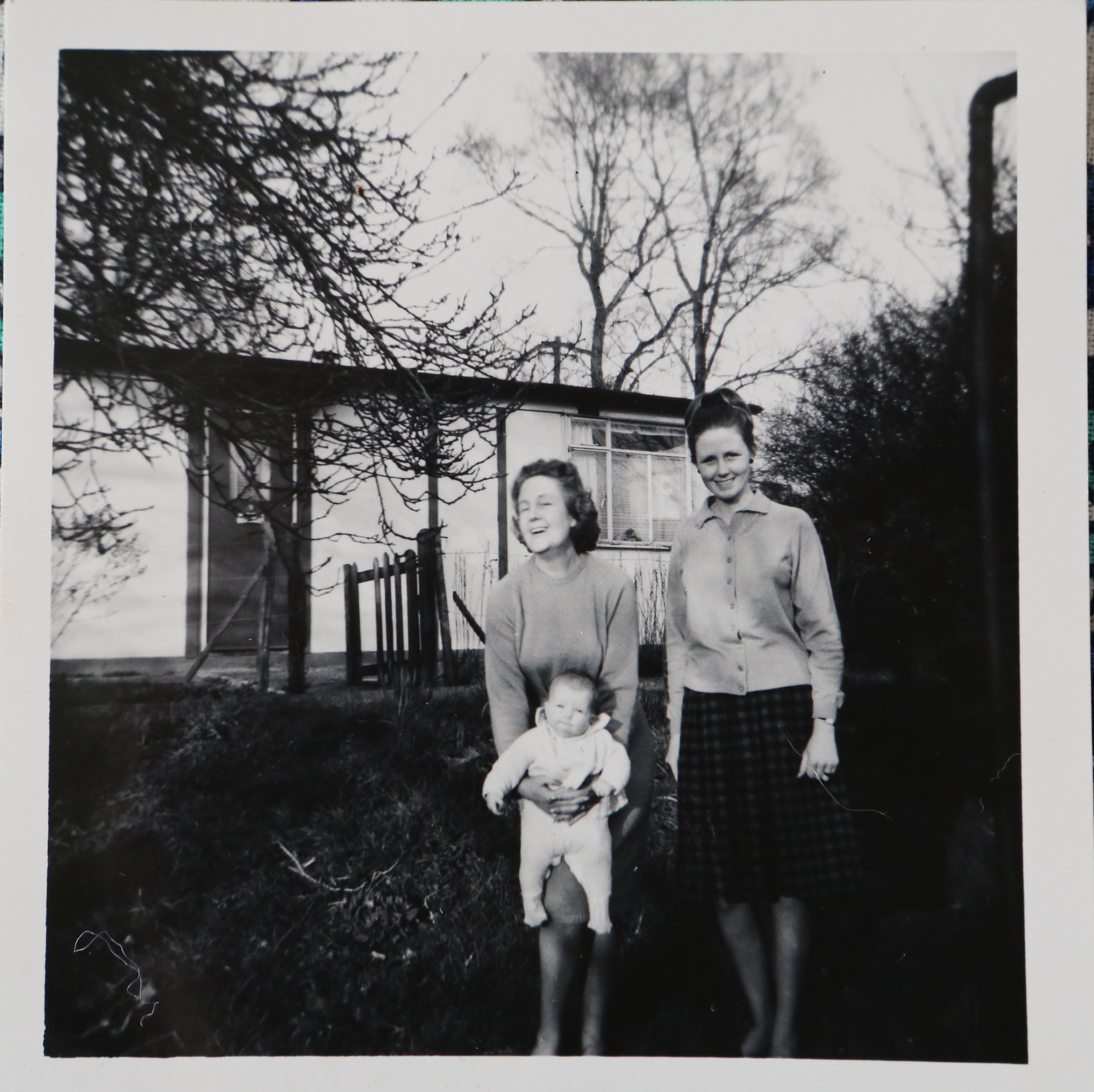 Penny Bishop and family outside their prefab in Willesden