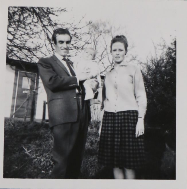 Penny Bishop as a baby with her mum and dad outside their prefab | Hearn, Jane