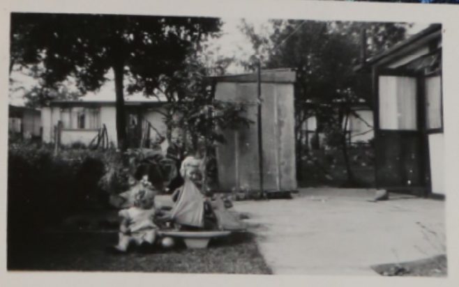 Two small children playing with a toy boat | Hearn, Jane