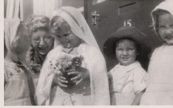 Kathryn, her brother Neal and three children in fancy dress outside the prefab, St Pauls Cray | Hearn, Jane