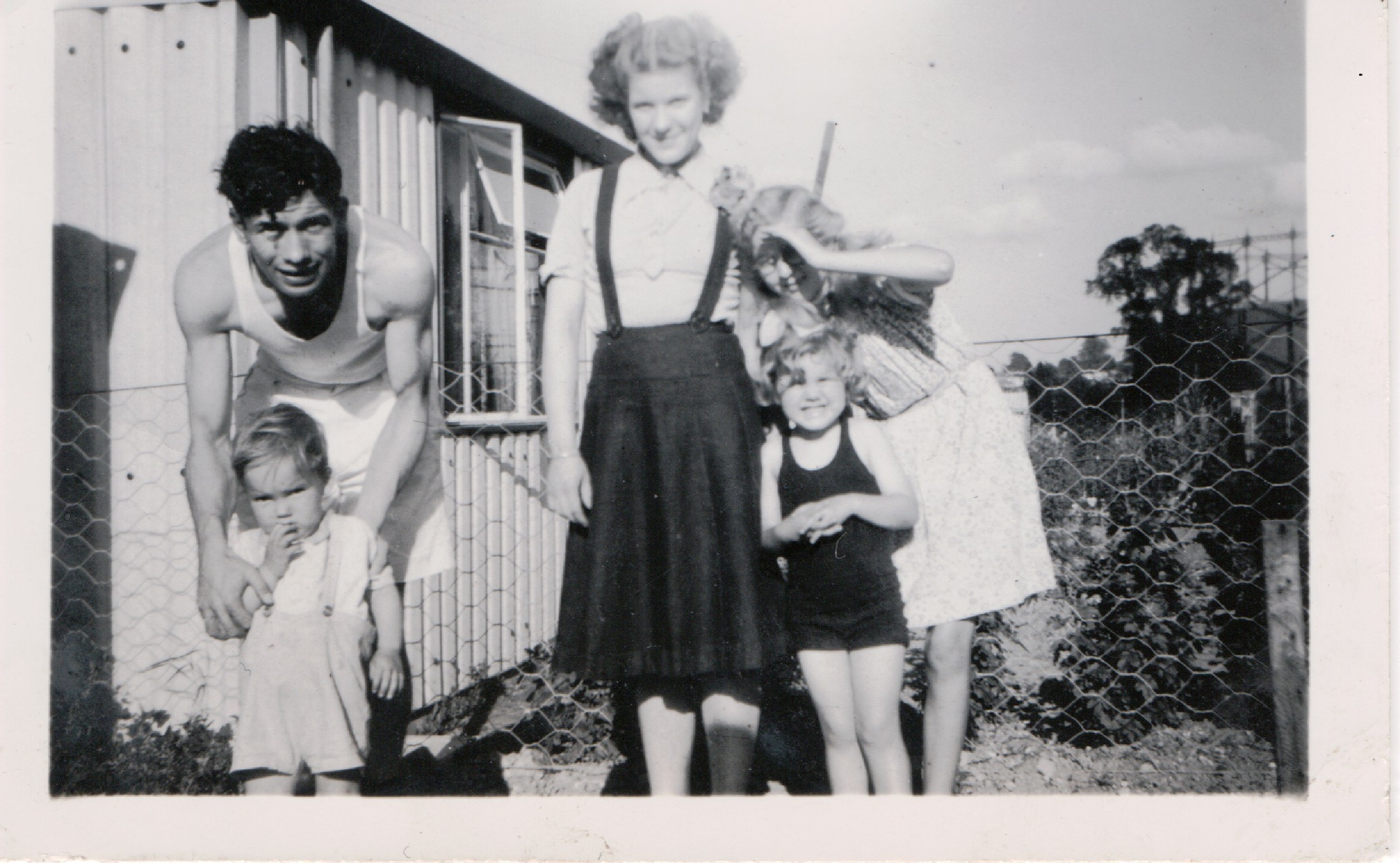 Kathryn, her brother Neal and mum and dad outside their prefab, St Pauls Cray