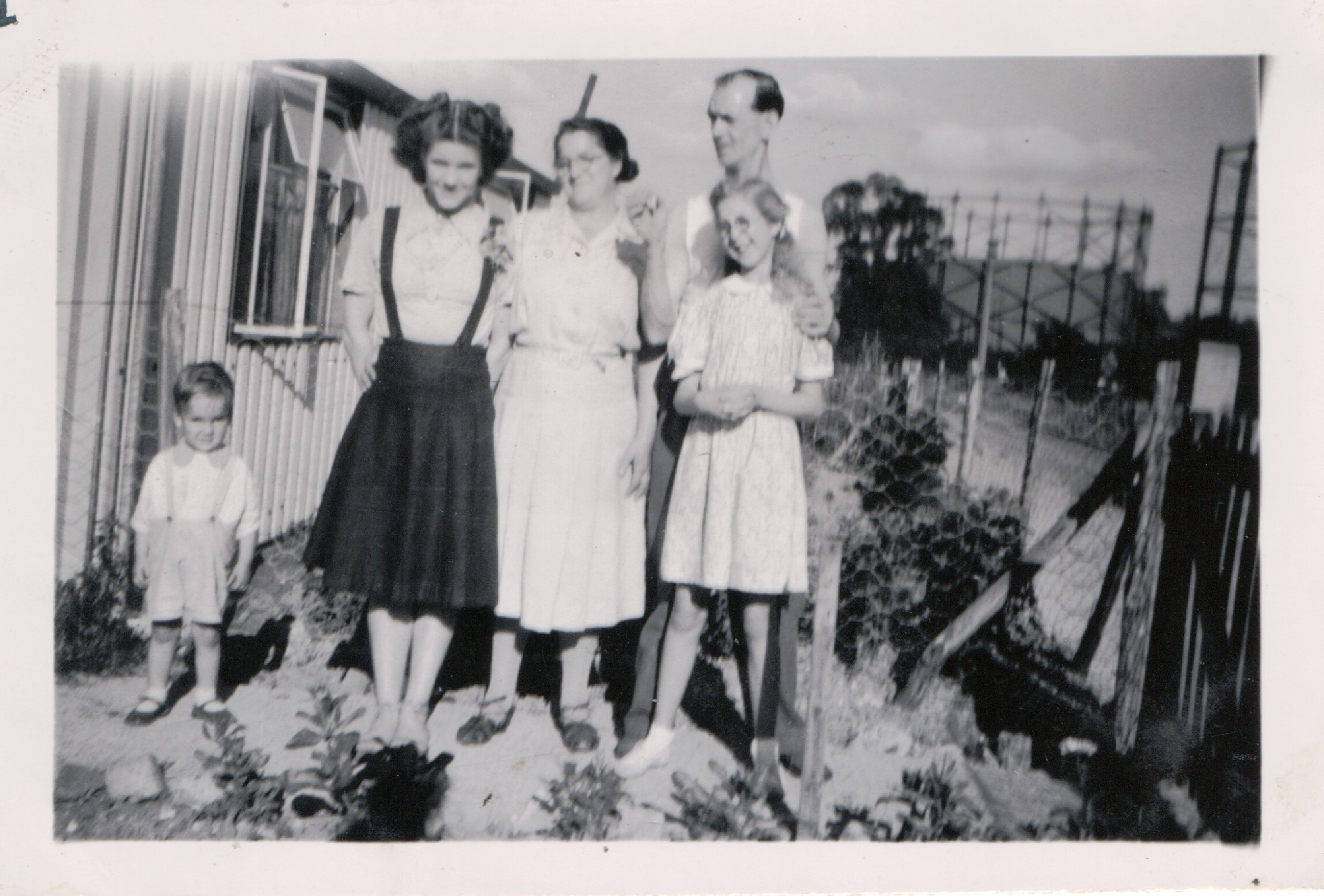 Family group outside the prefabs, Robin Way, St Pauls Cray