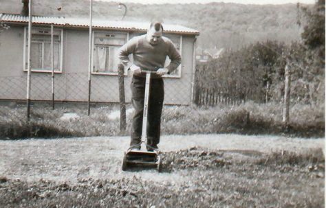 Mowing the grass in the prefab garden, Barcombe Close, Eastbourne