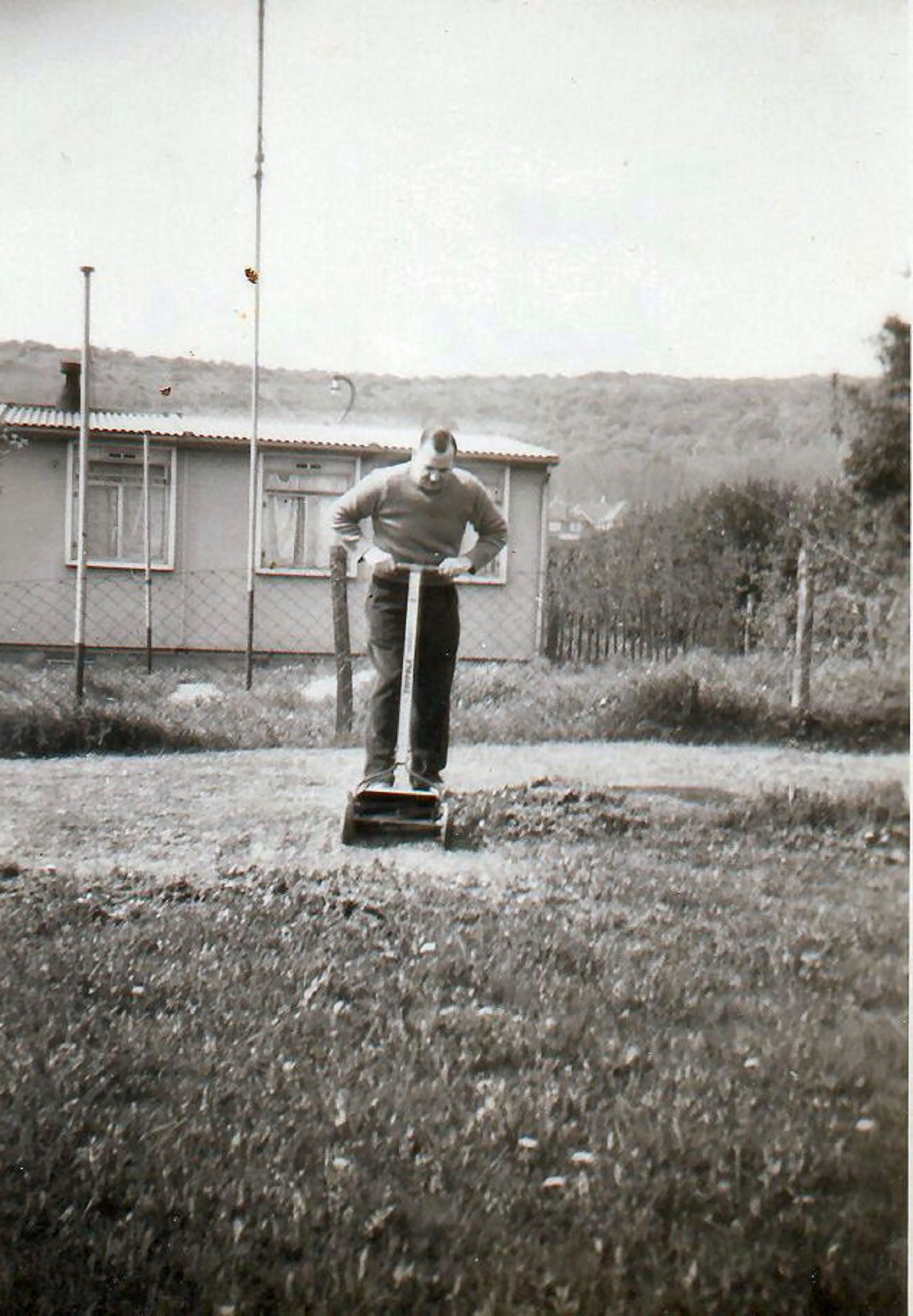 Mowing the grass in the prefab garden, Barcombe Close, Eastbourne