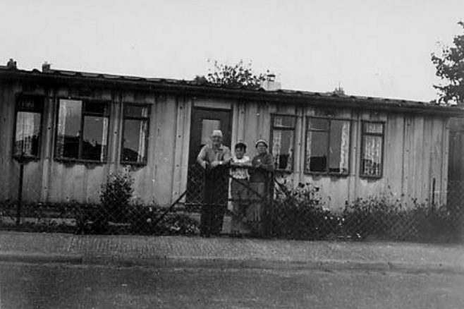 Peter Gale's family in front of their prefab, the second they were allocated in Portsmouth