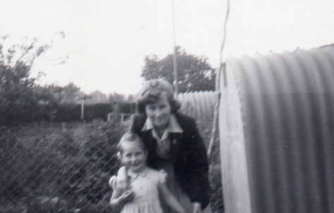 Judy Hewins and her sister in their prefab garden