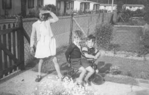 Three children, two on a bicycle, Shrublands Estate, New Addington