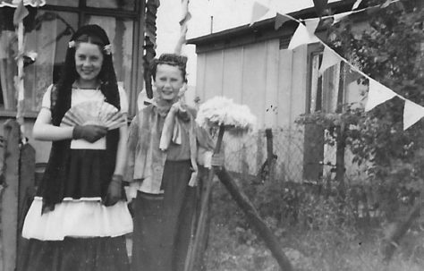 Two children in fancy dress, 'Mrs Mop'.  Stewart Street, London E14