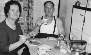 Mum and Dad in the prefab kitchen.  Stewart Street, London E14 | George Warren