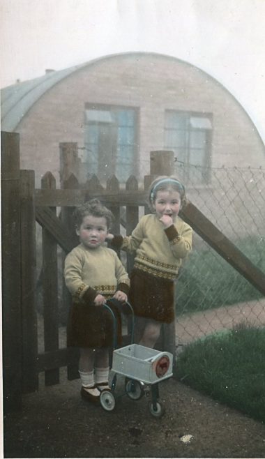 Pat and Kathy in front of the Nissen Hut, Bentham Road, London E9