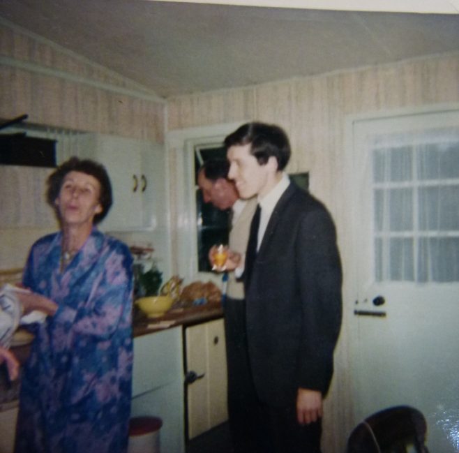 Woman and man in prefab kitchen, 401 Wake Green Road, Moseley