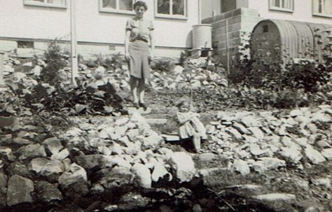 Suzanne and her mother in the back garden of their prefab at Brake Road, Crown Hill