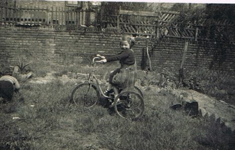 Mo in prefab garden, Narford Road, London E5