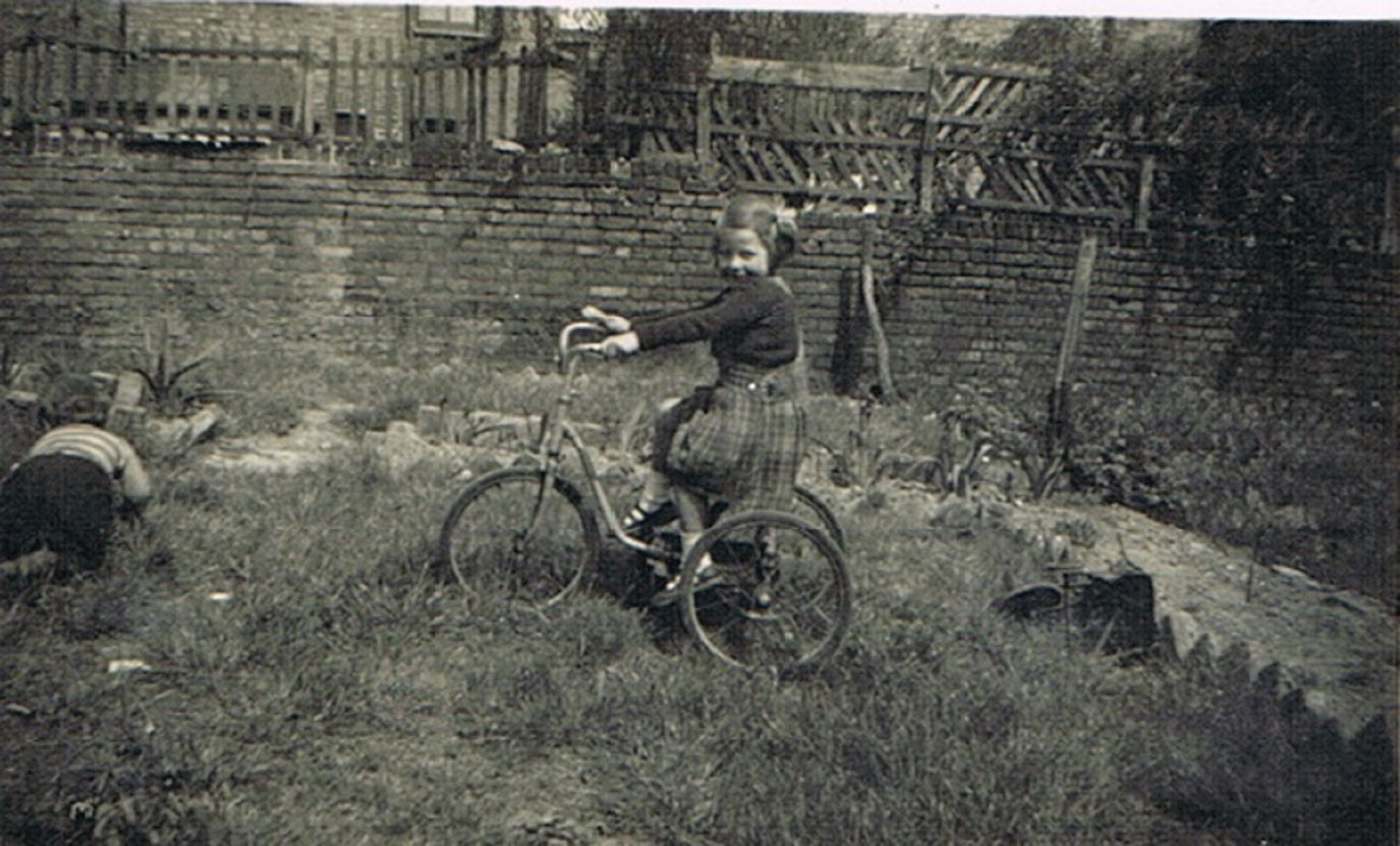 Mo in prefab garden, Narford Road, London E5