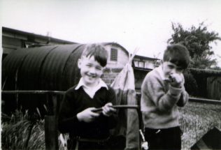 John and friend in prefab garden, Underhill Road, London SE22 | John Chinery