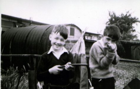 John and friend in prefab garden, Underhill Road, London SE22