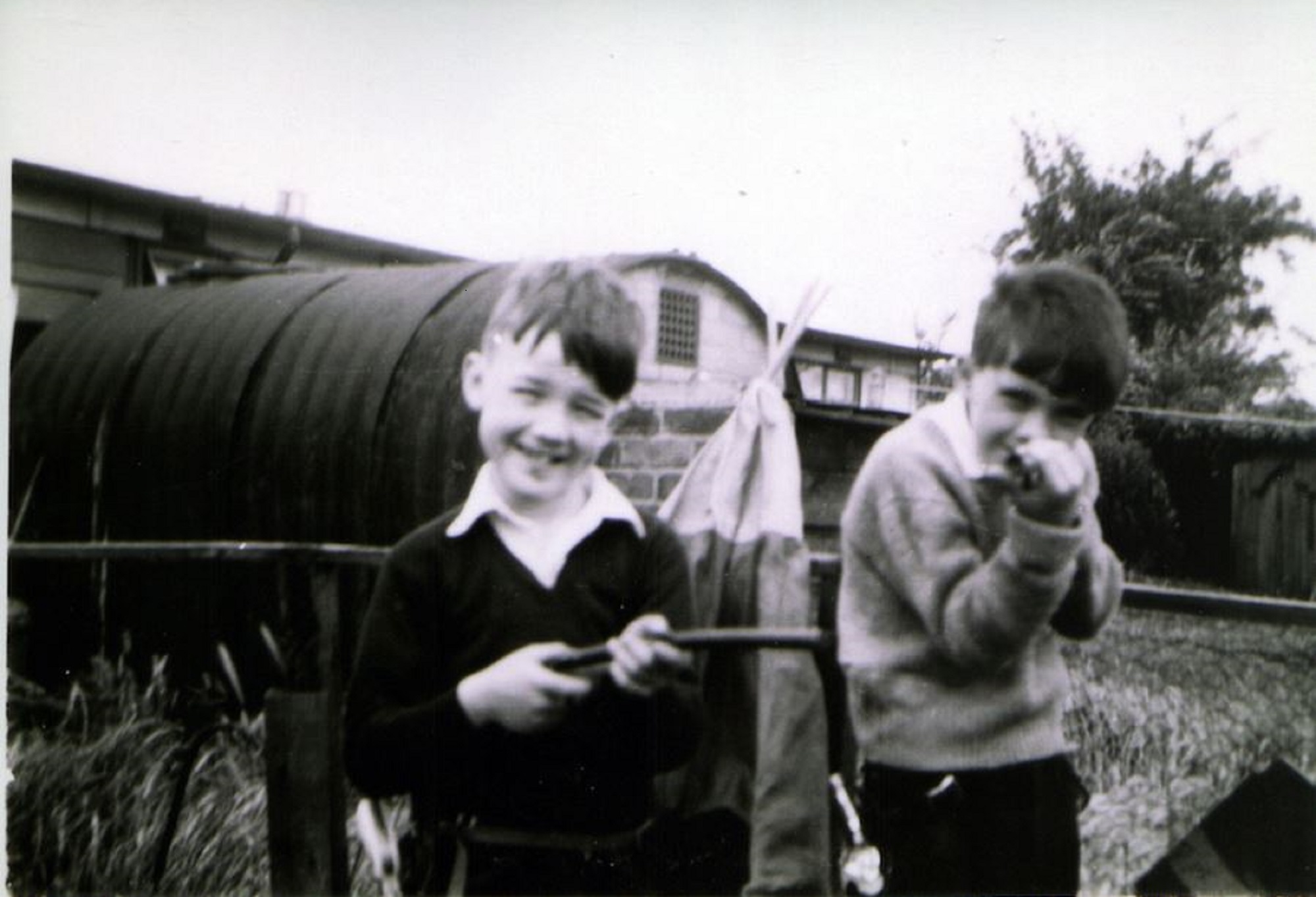 John and friend in prefab garden, Underhill Road, London SE22