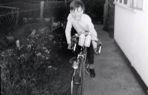 John on his bike by the prefab in Underhill Road, London SE22