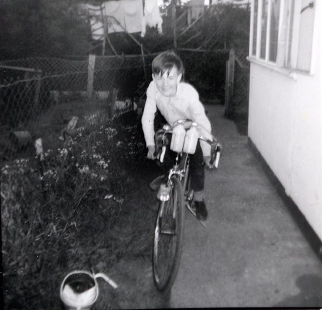 John on his bike by the prefab in Underhill Road, London SE22