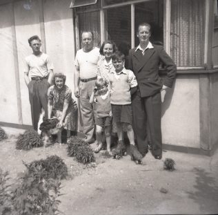 Catherine's cousins, her Nan, and her aunt and uncles outside their prefab in Carol Street, Camden Town. Catherine's cousins, her Nan, and her aunt and uncles outside their prefab in Carol Street, Camden Town. | Catherine Bazell