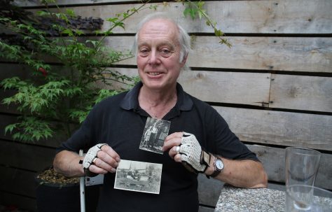 Portrait of Ben Bazell with his photos