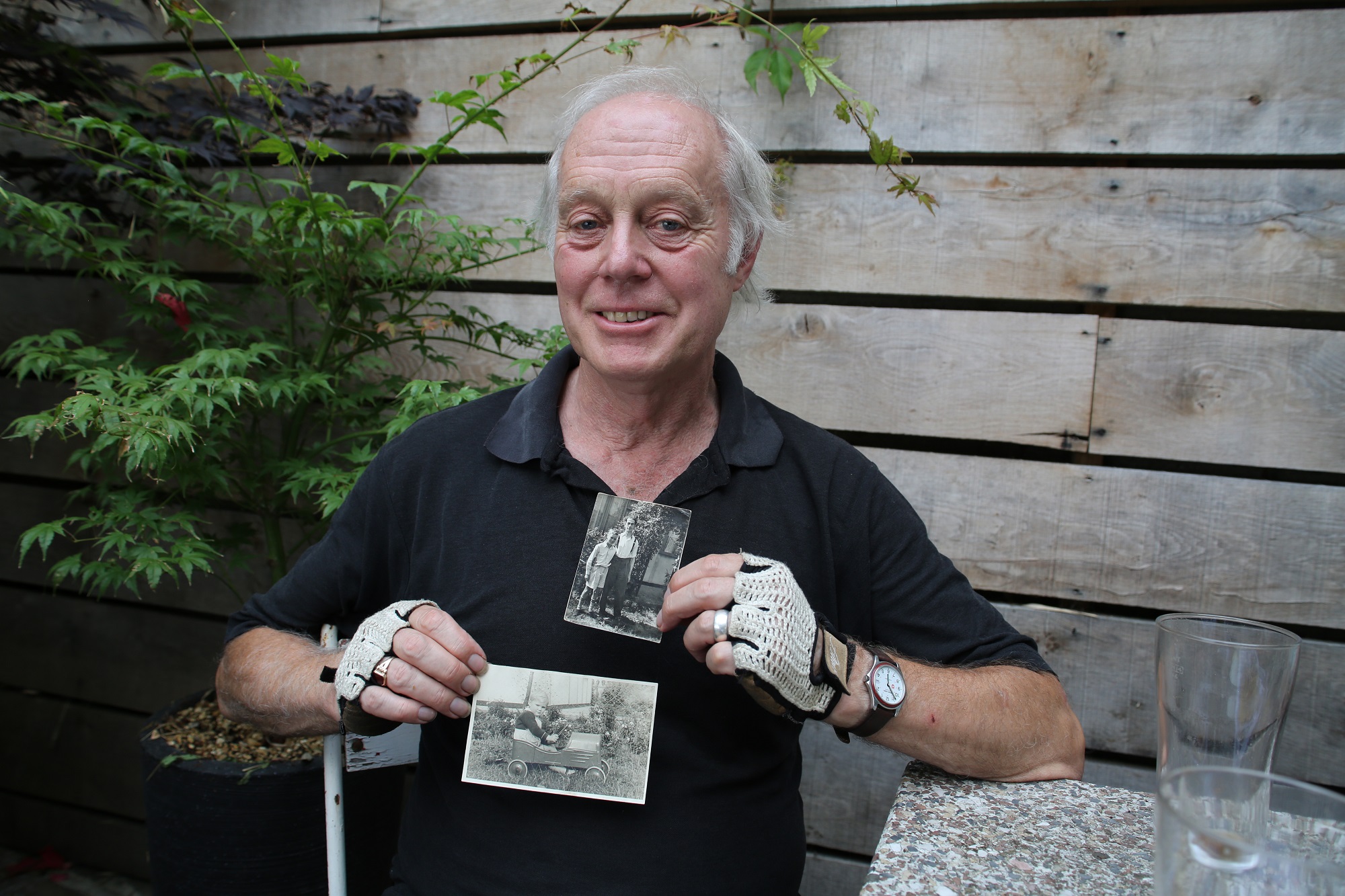 Portrait of Ben Bazell with his photos