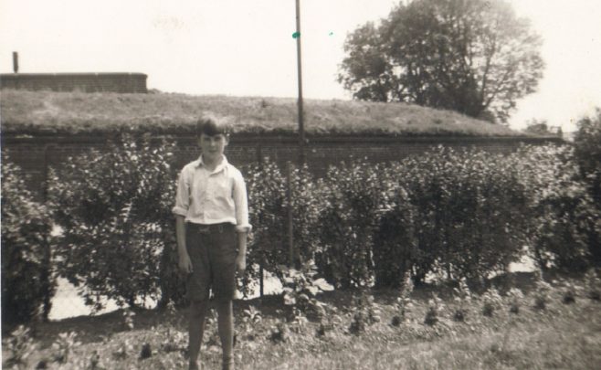 Terence's next door neighbour John standing by the hedge in his prefab garden, Dartmouth Park Hill, London NW5