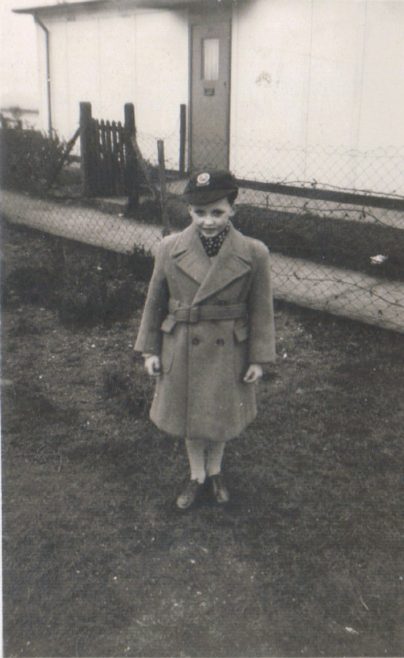April 1956. Terence in his first Crombie overcoat in front of the prefab, Dartmouth Park Hill, London NW5