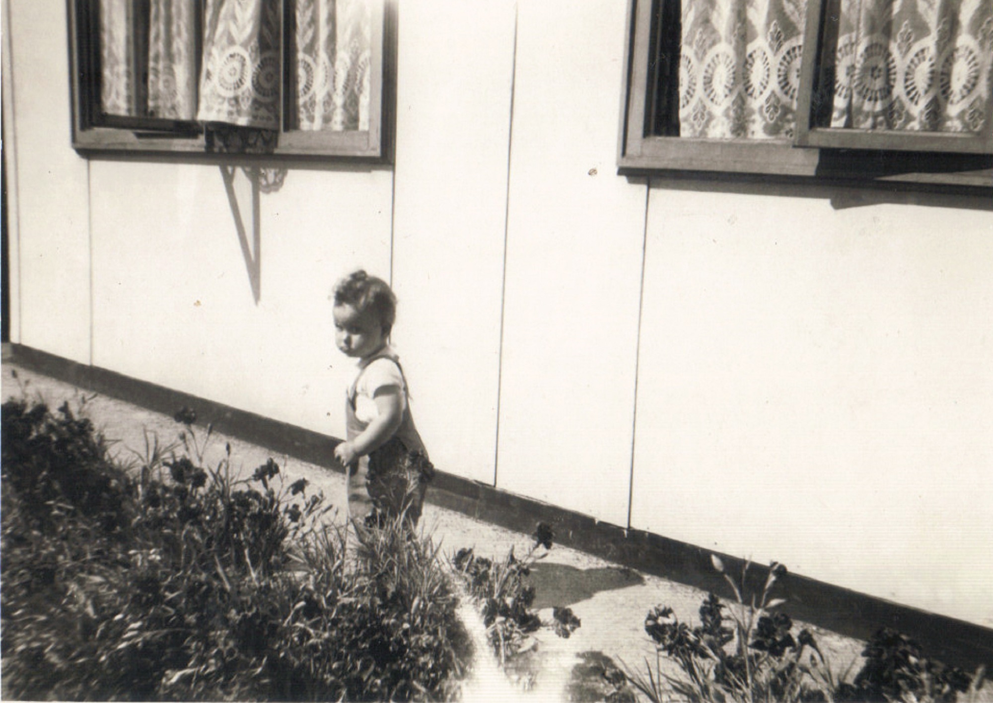 Terence's cousin Denise outside his prefab, Dartmouth Park Hill, London NW5