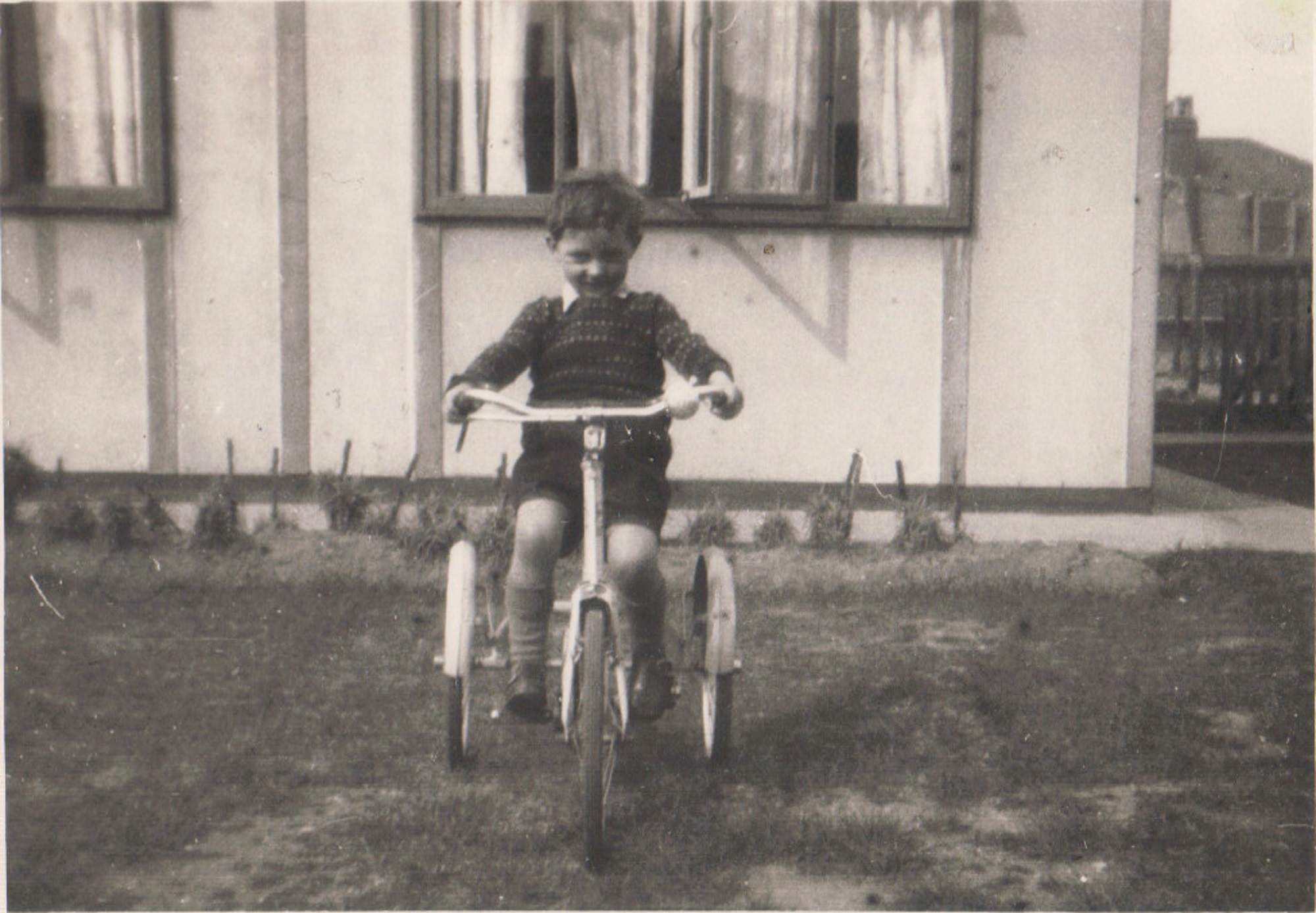 Terence on his tricycle outside the prefab, Dartmouth Park Hill, London N19