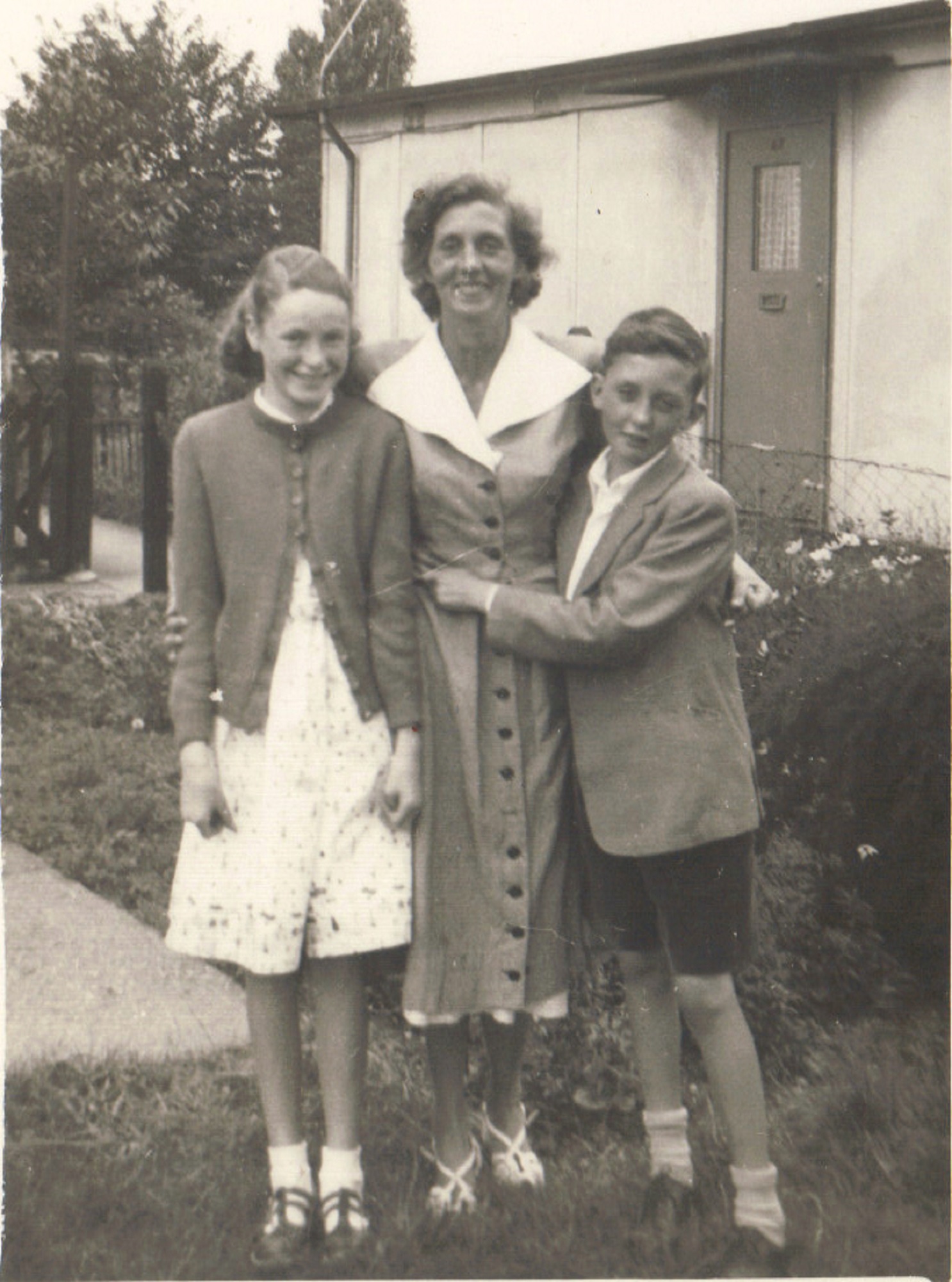 Terence, his mother and cousin Patricia from Blyth Northumberland, outside the prefab, Dartmouth Park Hill, London NW5