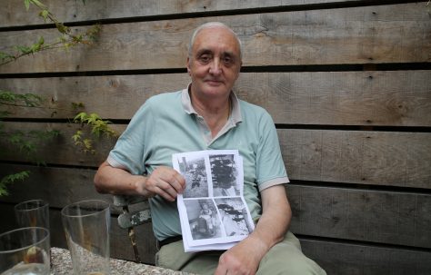 Portrait of Terence Flanagan with his photos